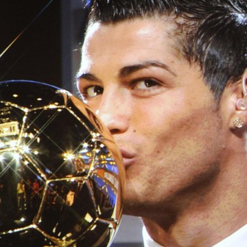 Cristiano Ronaldo kissing the Ballon d'Or trophy